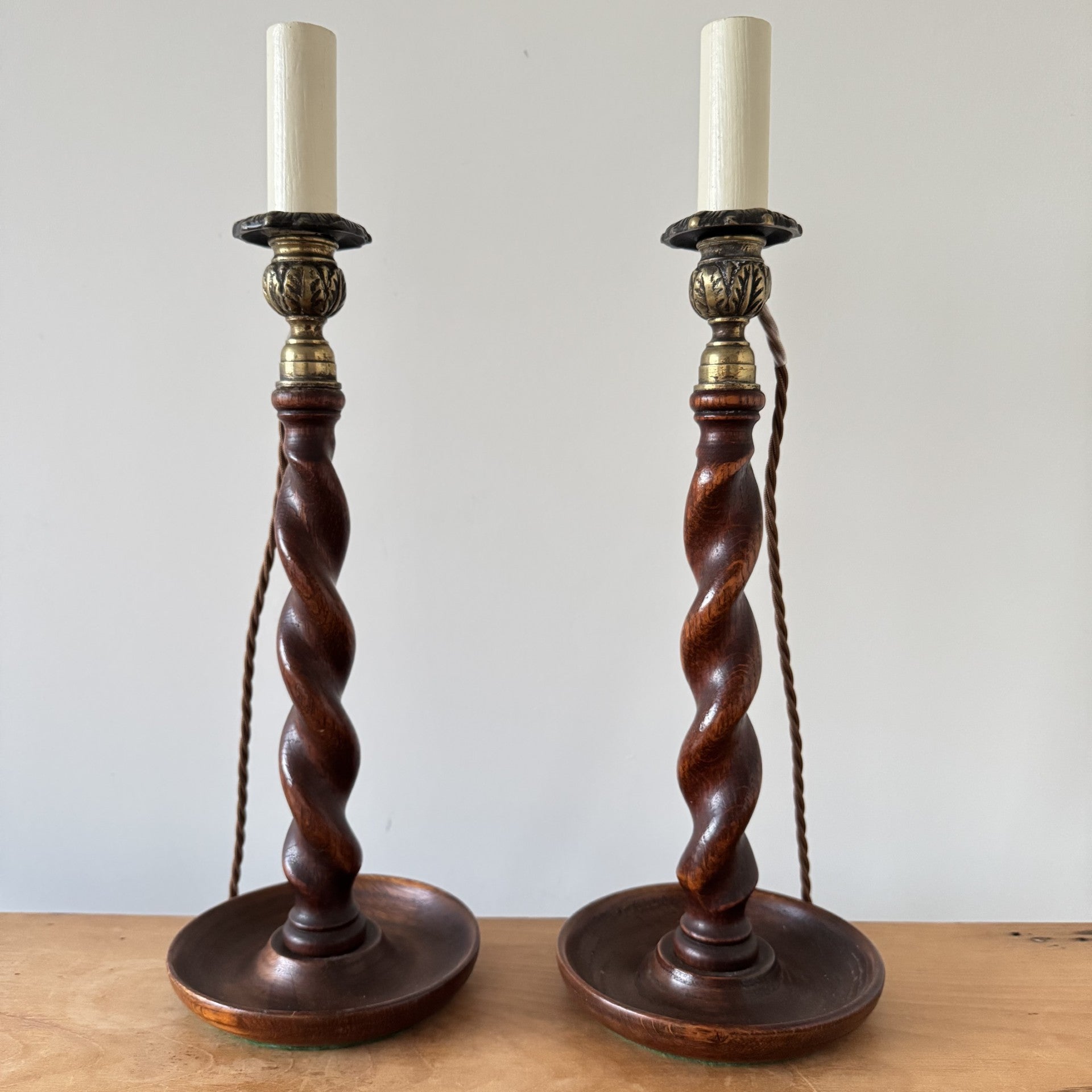 Pair of Vintage wooden barley twist candlesticks with brass candle cups