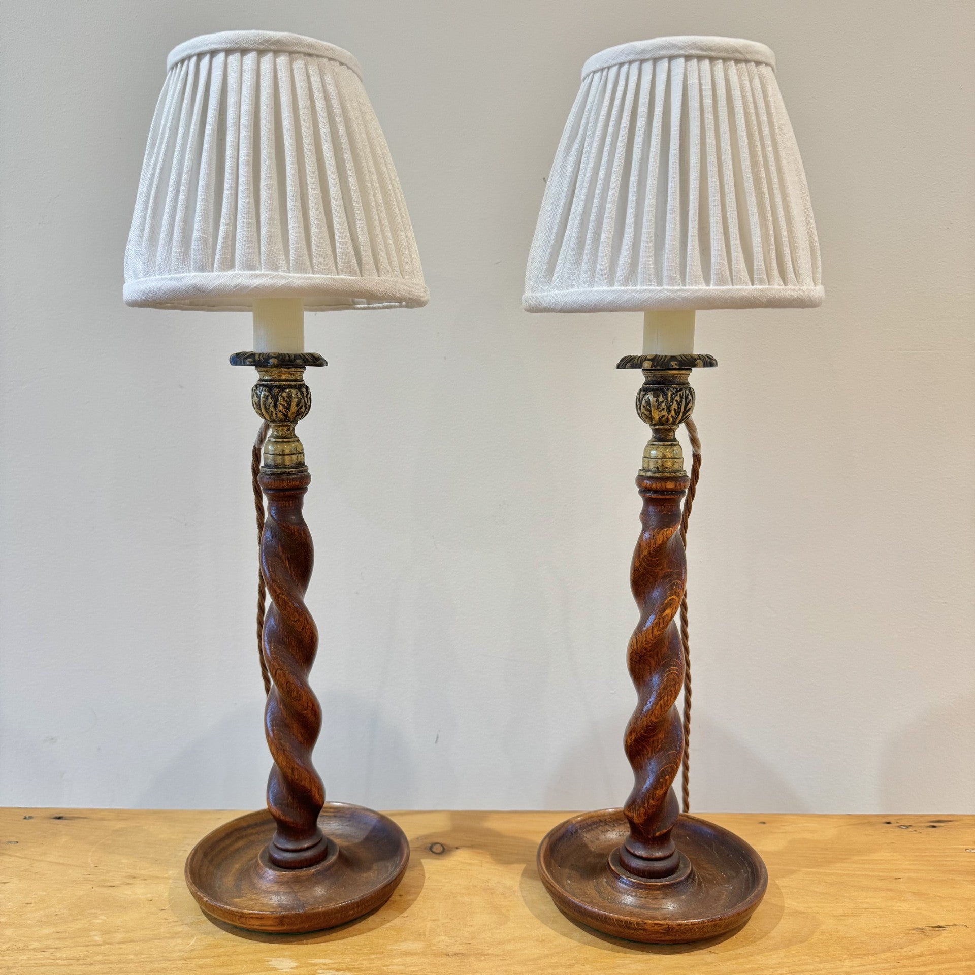 Pair of Vintage wooden barley twist candlesticks with brass candle cups